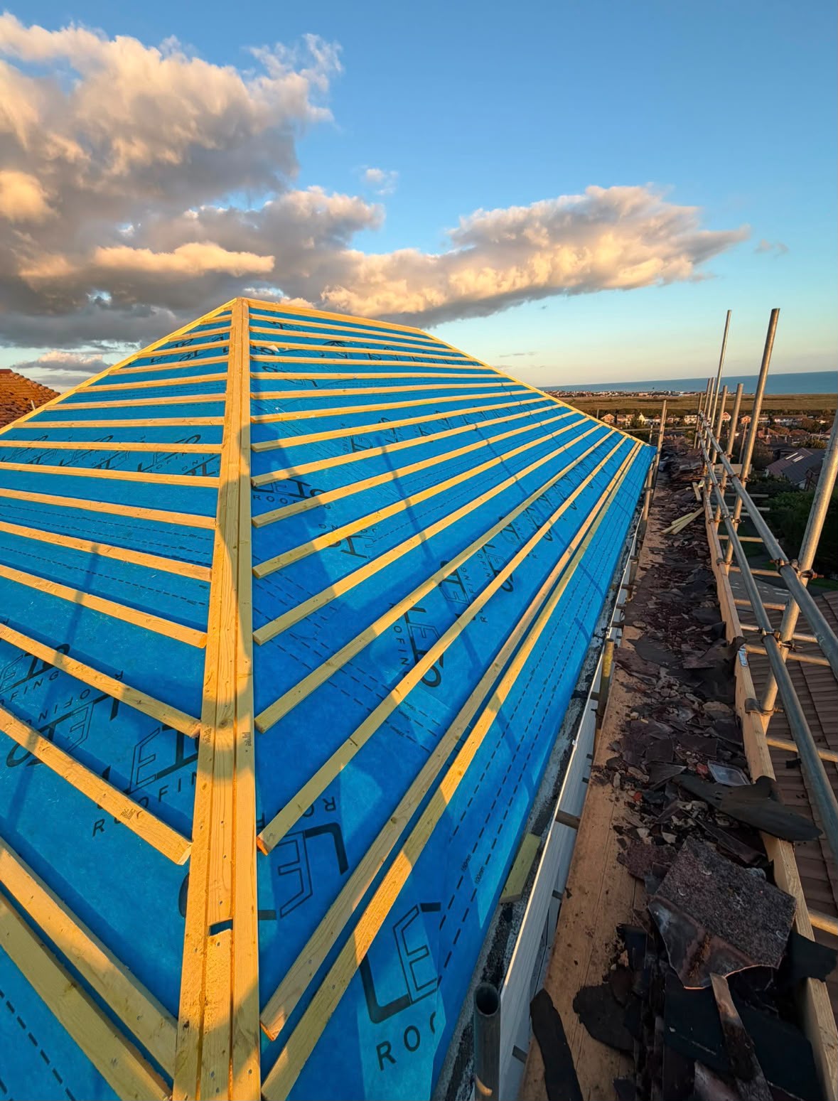 Roofer working on a roof with breathable membrane and timber battens